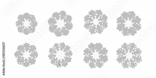 Arrangement of eight circular gray fractal like patterns on a white background