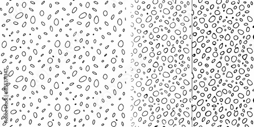 Abstract black and white pattern resembling scattered droplets or grainy texture