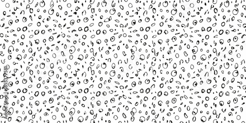 Abstract black and white pattern of scattered random circular shapes