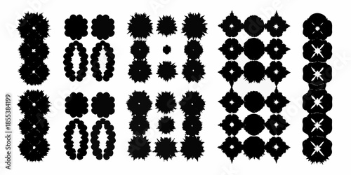 Abstract arrangement of black circular and diamond shapes on a white background