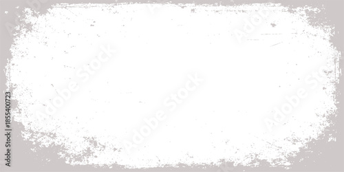 Aged grey stone wall texture with a blank vintage frame on a rough grunge paper backdrop featuring dusty paint splatters and an old dirty surface pattern for an abstract design