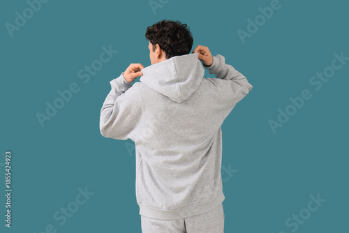Young man in grey sports su...