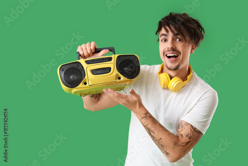 Young man with boombox on g...