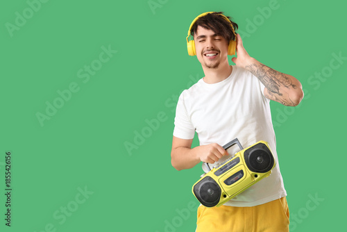 Young man in headphones wit...