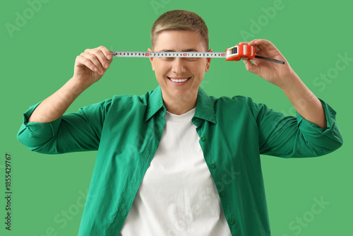 Young woman with tape measu...