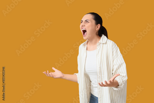 Screaming young woman on or...