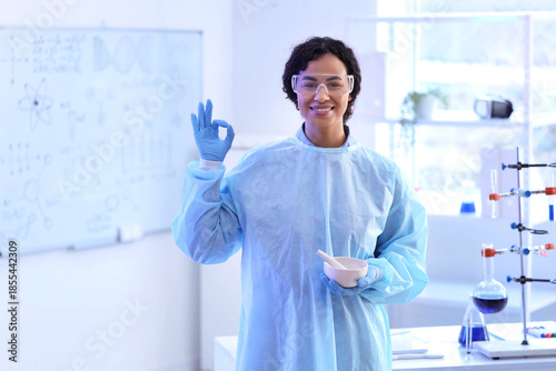 Smiling female scientist in...