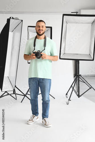 Handsome photographer with ...