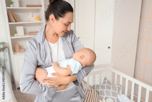 Happy young mother with her...