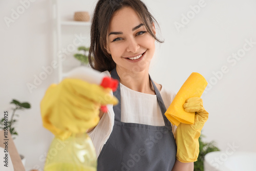 Female janitor with rag and...