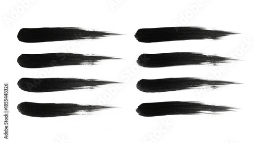 Eight black brush strokes on white background, artistic paint smears for design, creative graphic resource