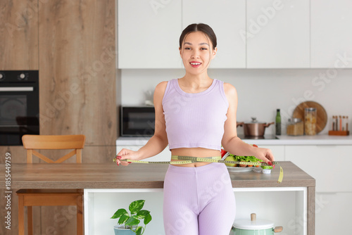 Sporty young Asian woman me...