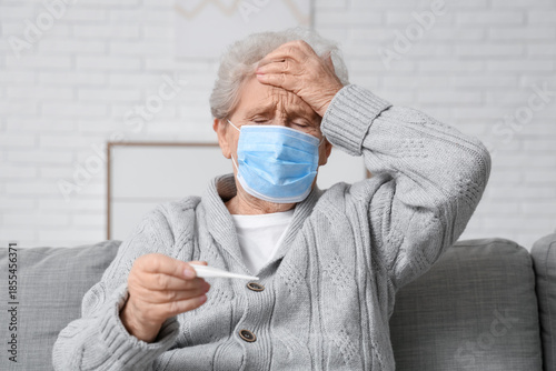 Sick elderly woman in medic...