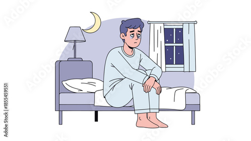 Lonely young man sitting on bed at night feeling sad and pensive in a quiet