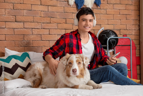 Teenage boy in headphones w...