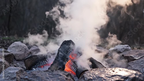 Outdoor Camping Fire with Water Pouring.