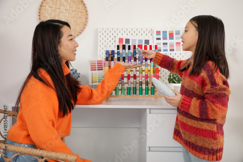 Happy Asian mother and her ...