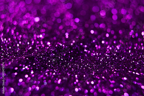 Purple glitter bokeh abstract background for Christmas and New Year.