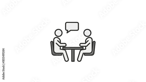 Two people sitting at a table having a conversation.