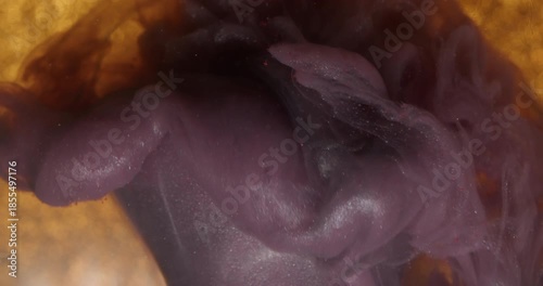 Mist mix. Cloud texture. Defocused yellow golden purple color ink glitter flow wave water broken light bulb spreading on abstract bokeh background.