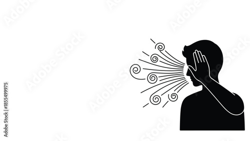 Silhouette of a person shielding their face from strong winds and swirling particles