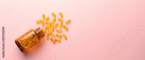 Pills and Bottle on Pink: A top-down shot showcases a spilled bottle of golden pills, scattered on a soft pink surface. The composition creates a minimalist aesthetic, evoking health and wellness.
