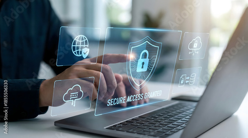 Cuadro en lienzo Hand,pointing,at,digital,display,showing,secure,access,granted,message,with,padlock,and,shield,symbols,concept,of,authorized,entry,into,confidential,cloud,database,and,corporate,information
