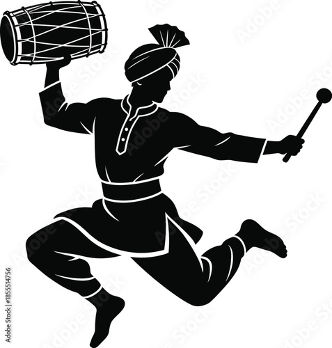 Dancer jumping with dhol drum during festival celebration 