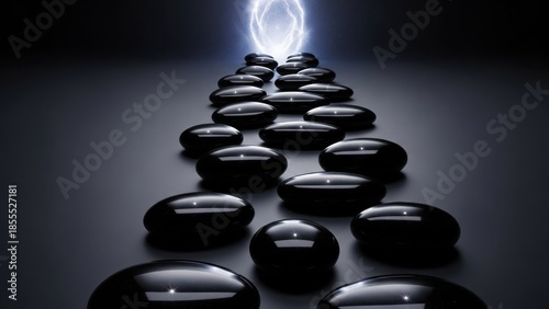 Spa stones arranged in a pyramid with light.