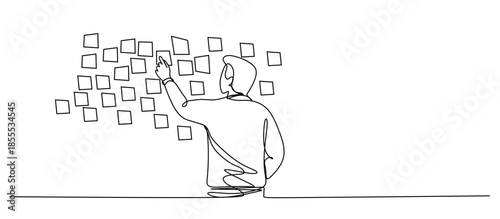 Brainstorming sessions  using sticky notes on a kanban task board to organize ideas and workflow in a modern office.