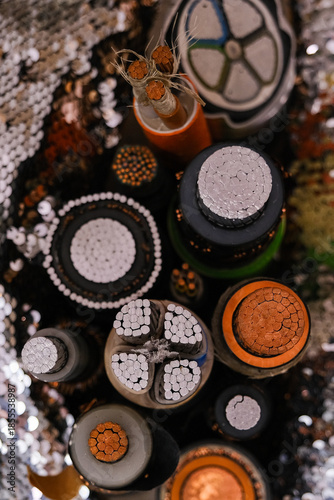 Cross sections of various electrical cables showing copper and aluminum wires. Concept of robust telecommunication and power transmission industry infrastructure.