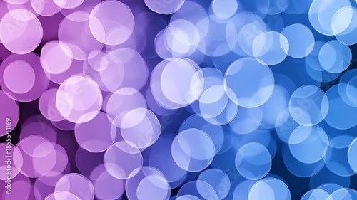 Beautiful bokeh effect image composed of gradient circles in purple and blue hues. This creates a dreamy visual, perfect for backgrounds