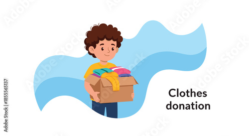 Cute young boy holding a cardboard box filled with clothes for donation, illustrating the concept of charity and helping others.