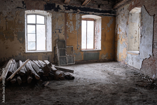 Canvas-taulu Derelict prison interior featuring two arched windows, crumbling walls with peeling yellow paint
