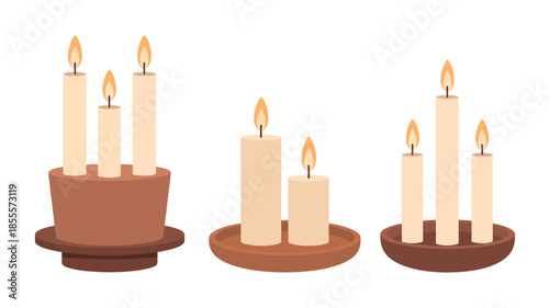 Three arrangements of lit tapered candles on dark brown holders