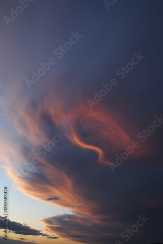 Vibrant sunset with swirling orange and purple clouds