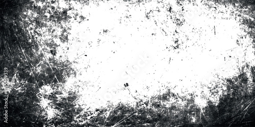 A heavily distressed black and white texture with a bright central area and rough scratched edges