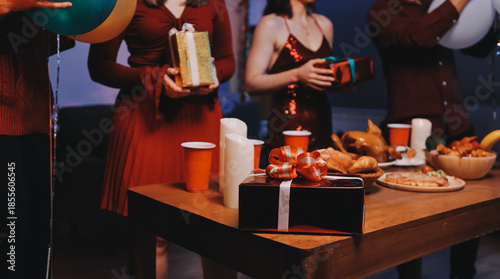 Festive Office Christmas Party with Delicious Food. A beautifully decorated office space with Christmas trees and festive lights, set up for a holiday party.