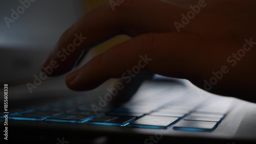 A woman types on her laptop at a cafe table, combining professional tasks with a calm social setting that supports concentration and creativity. Creative workflow.