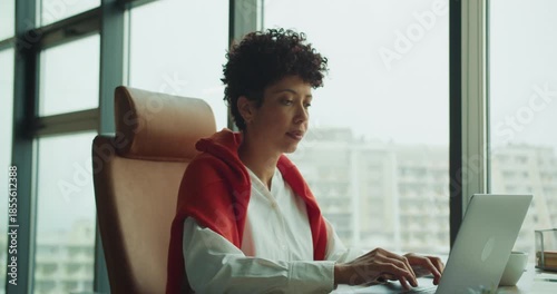 Person in red sweater developing new business concepts outside