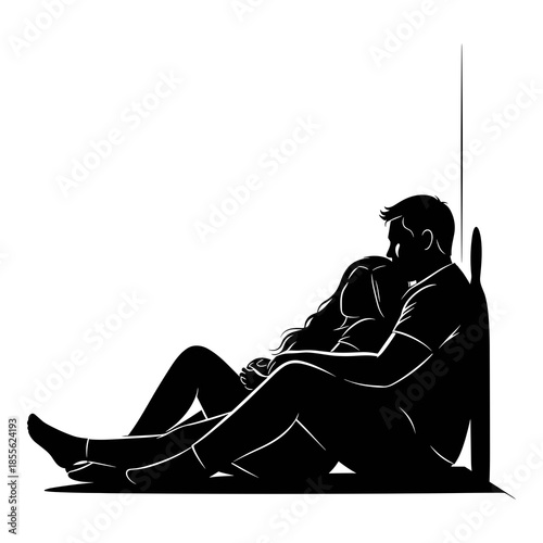 Silhouette of a loving couple embracing while sitting against a wall outdoors