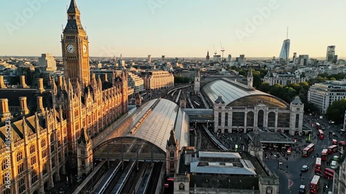 Aerial View of Big Ben, Westminster Palace, and Victoria Station in London at Sunset.