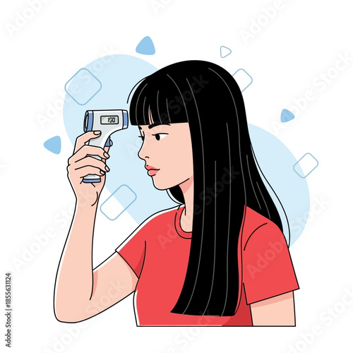 Young woman using an infrared thermometer to check her body temperature for health monitoring and fever detection