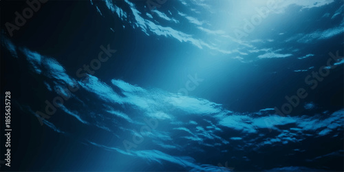 An abstract summer landscape of the deep blue ocean featuring an underwater world loop where sunlight rays pierce through waves reflecting a heaven of clouds across the horizon

Would you like me to g