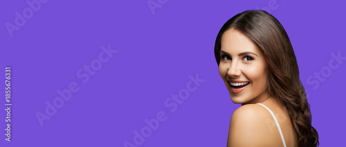 Portrait image of very happy, expressive emotional smile beautiful woman, isolated violet purple background with free text space. Cute cheerful joyful brunette girl at studio. Dental care ad