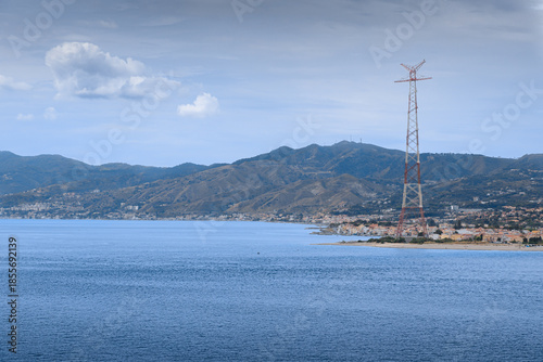 Glimpse of the Strait of Messina southern Italy: view of the Faro Point with the Pylon of Messina.