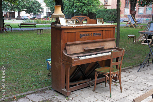 An antique piano from the early 20th century waiting for its performer in the park