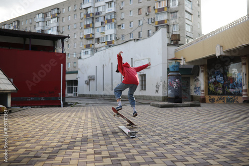 Teen girl wearing a red hoodie skateboards on a sunny day, conveying freedom, youthful energy, and an active lifestyle. High quality photo
