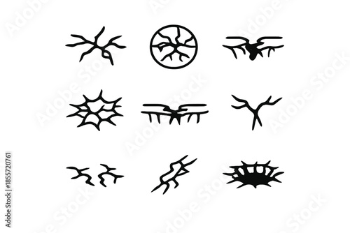 Set of abstract black crack and fracture symbols on gray gradient background