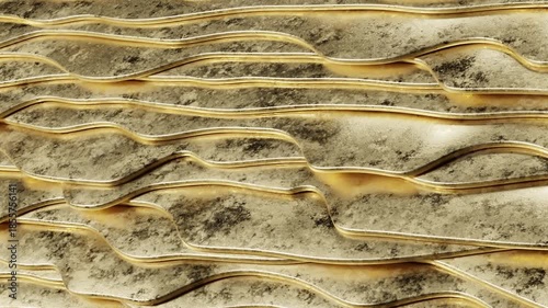 Close-up of abstract wavy lines on a textured surface, showcasing intricate patterns and colors Gold Curves Modern. Concept featuring abstract, wavy lines, textured surface, patterns, gold.